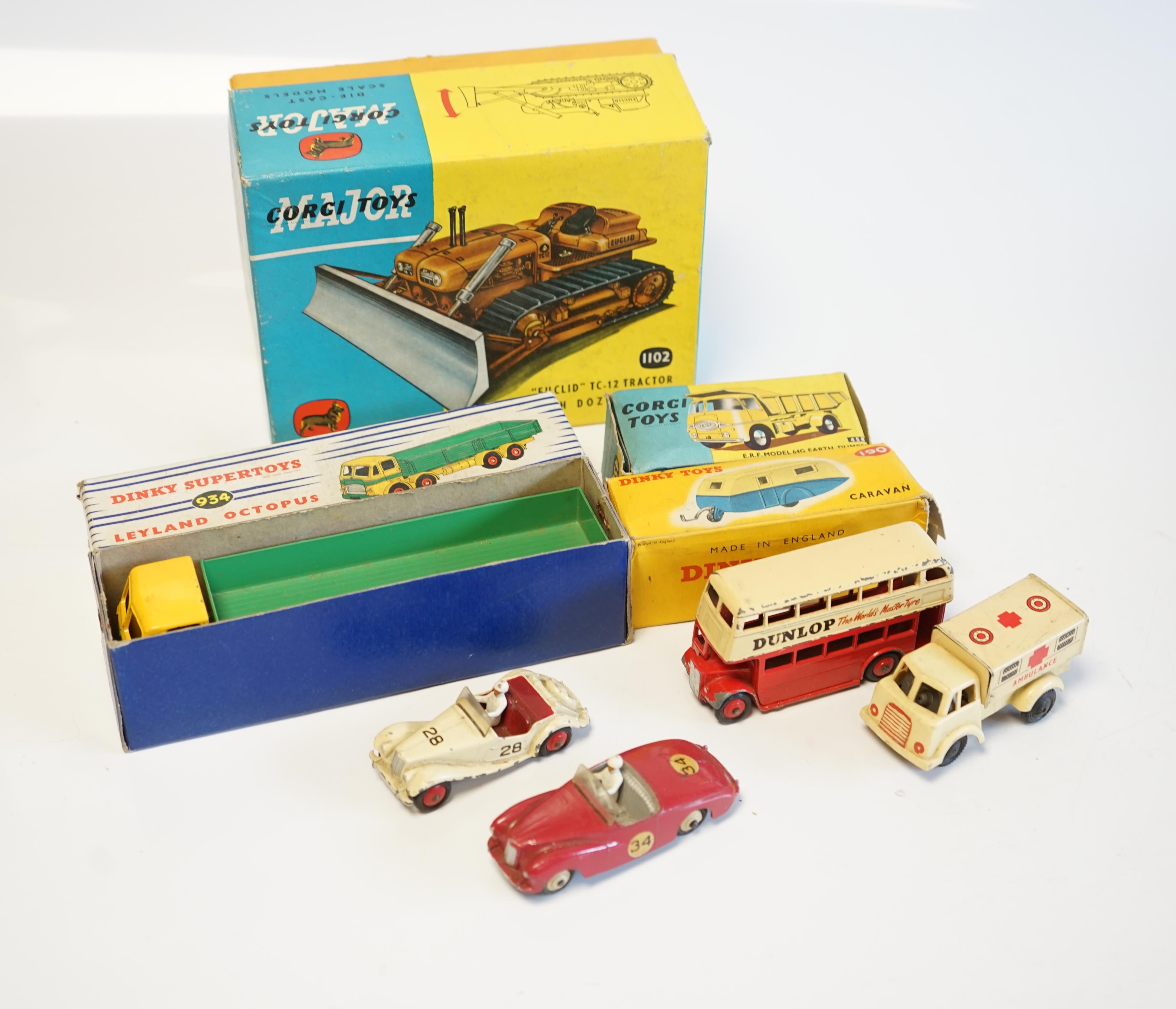 Seven diecast vehicles by Dinky Toys and Corgi Toys including; a Leyland Octopus Wagon (934), a Caravan (190), a Sunbeam Alpine, an MG Midget, a Double Decker bus, a Euclid TC-12 Tractor (1102), an ERF Model 64G Earth Du